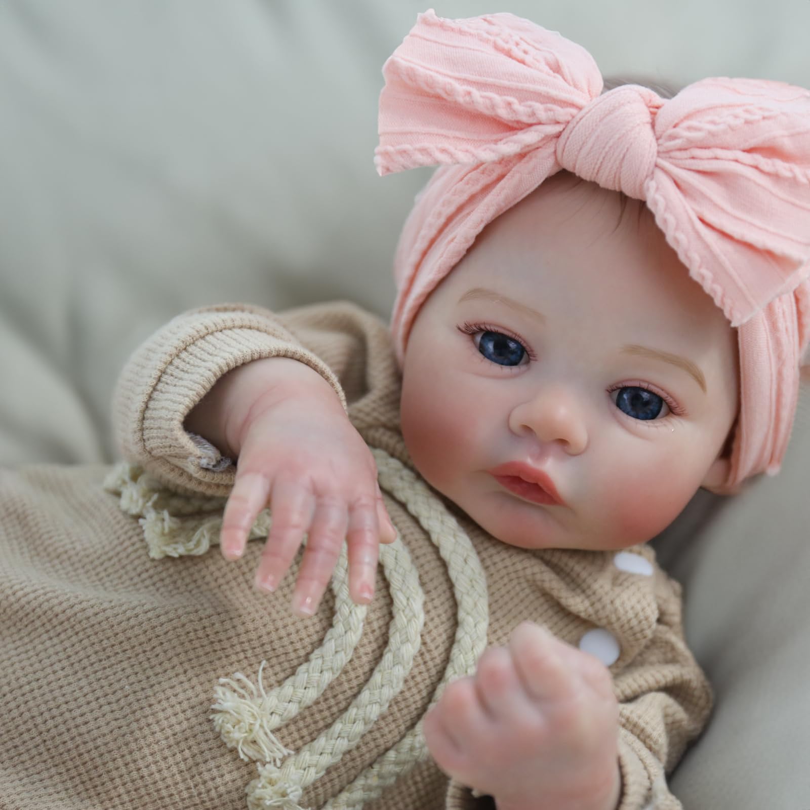 Lifelike reborn baby girl doll with poseable vinyl limbs