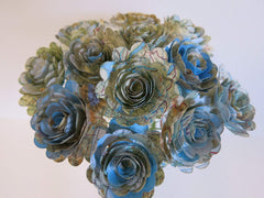 Eight inch cloth-covered stems supporting one dozen roses