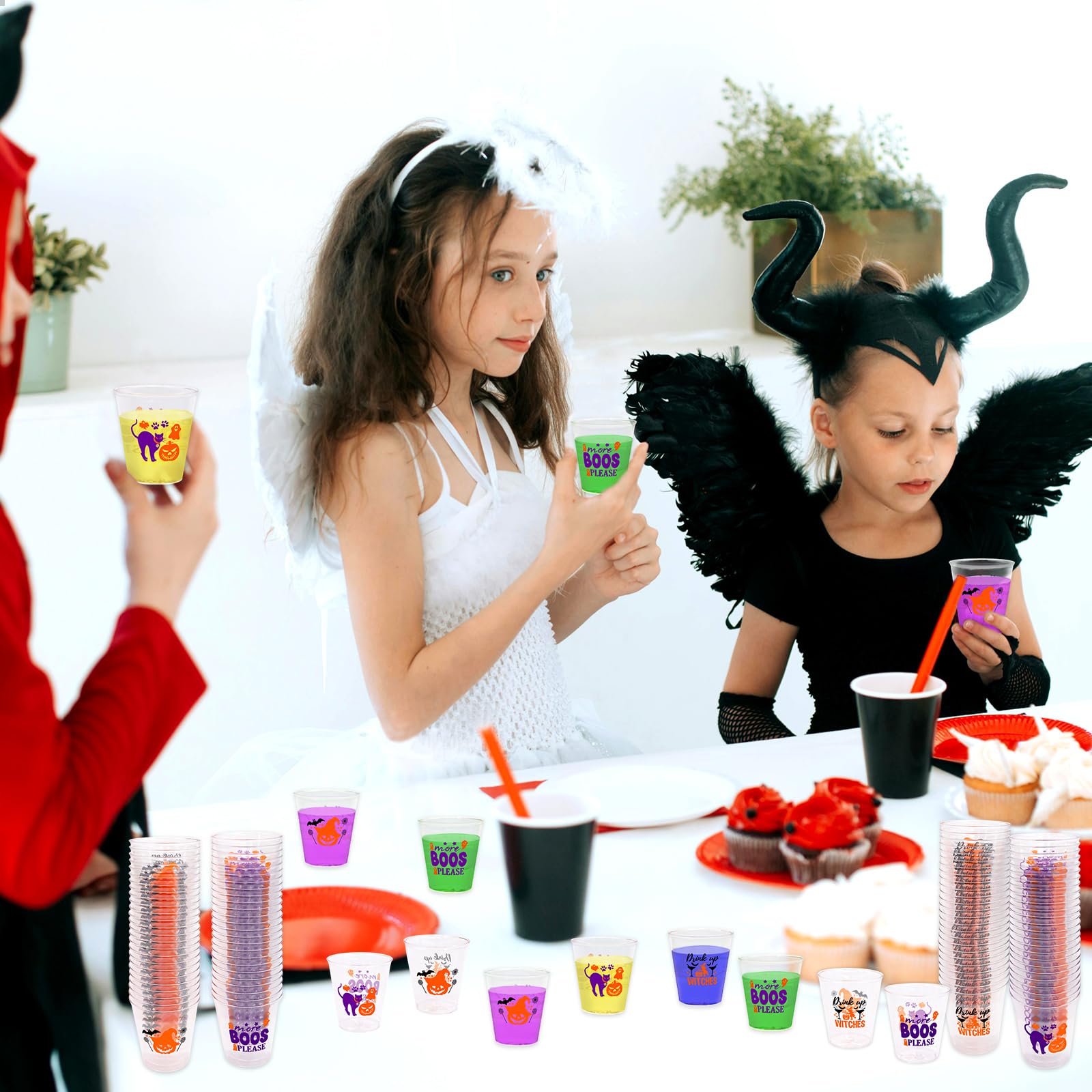 Pumpkin and witch designs on WorldBazaar shot glasses