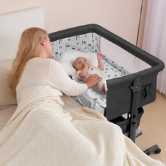 Dark gray bassinet with wheels and storage