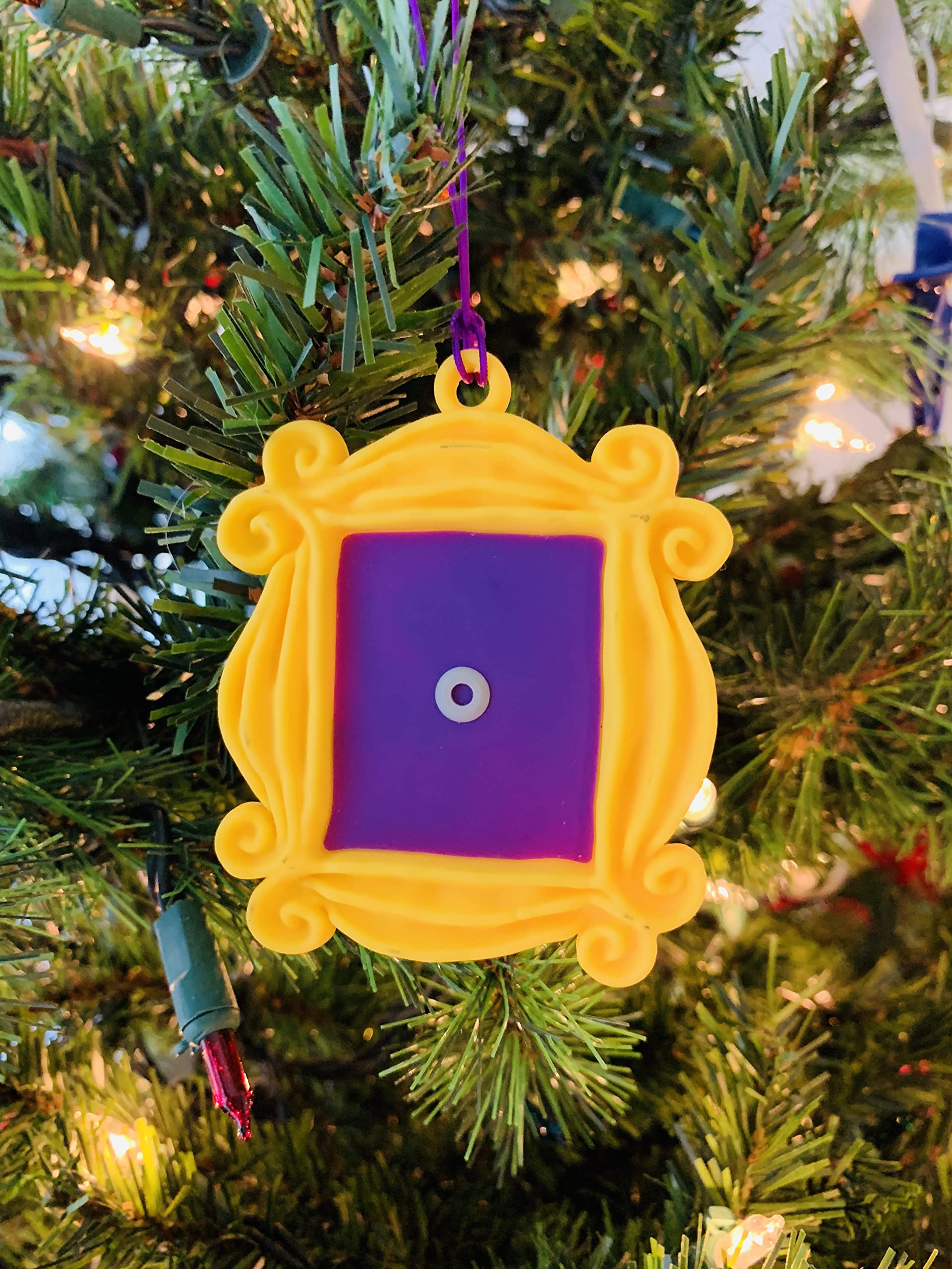 Yellow Peephole Door Frame ornament detail