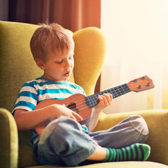 Coated surface finger safety ukulele toy close up