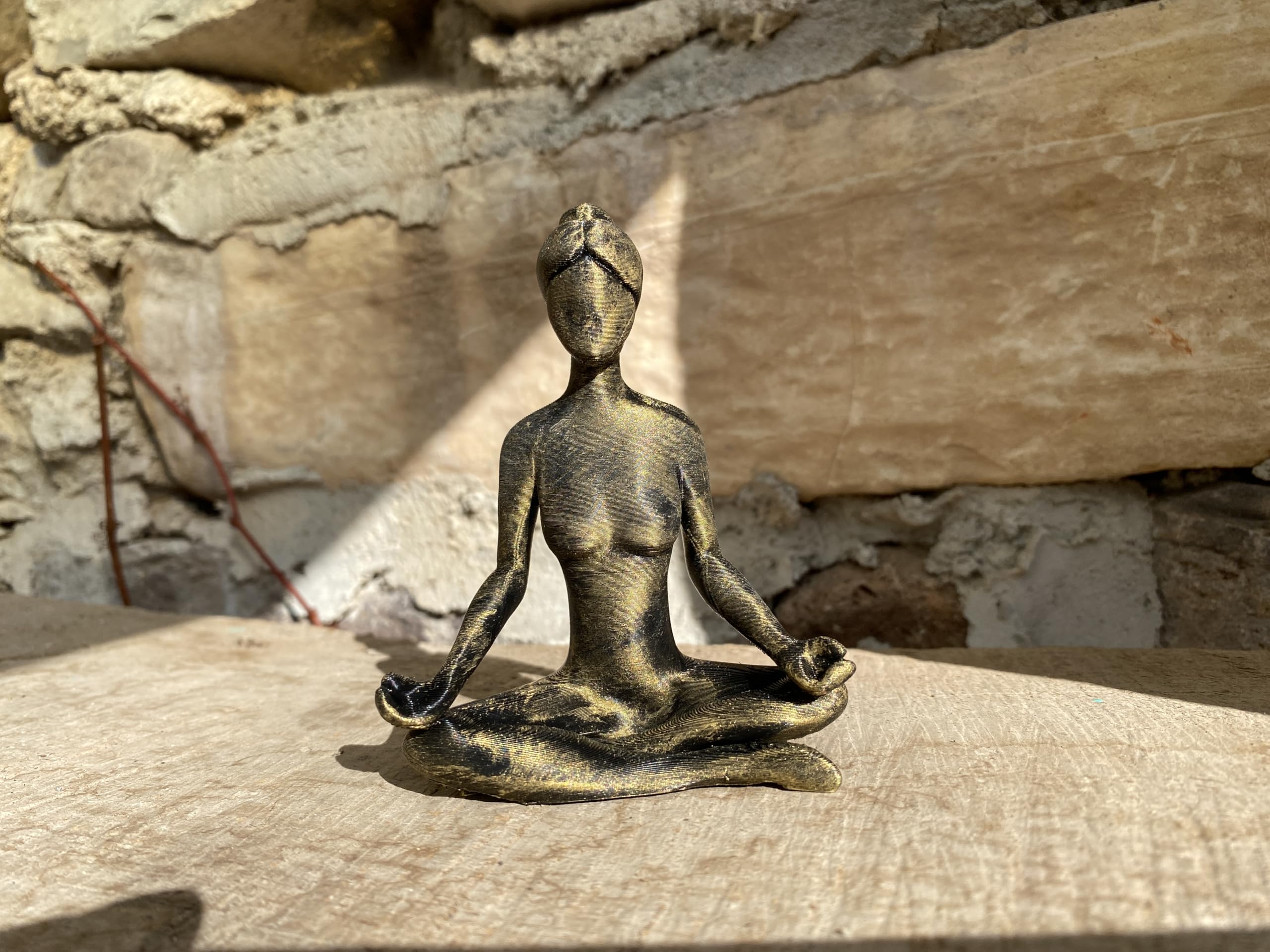 Zen meditation figurine placed on a desk