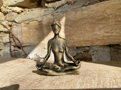 Zen meditation figurine placed on a desk