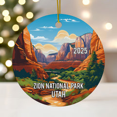 Glossy ceramic round ornament with canyon landscape and gold hanging cord