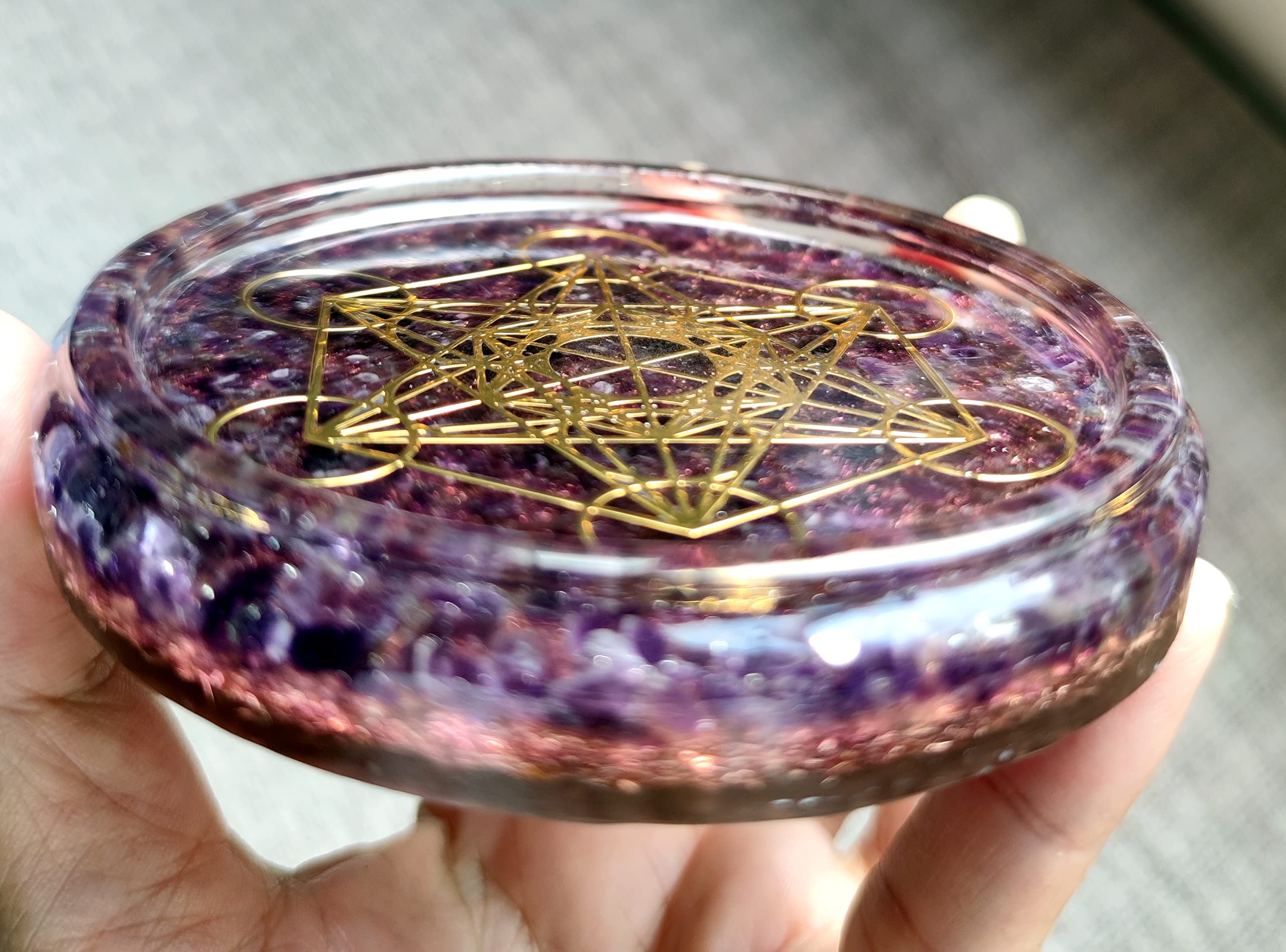 Triskelion symbol embedded in resin coaster