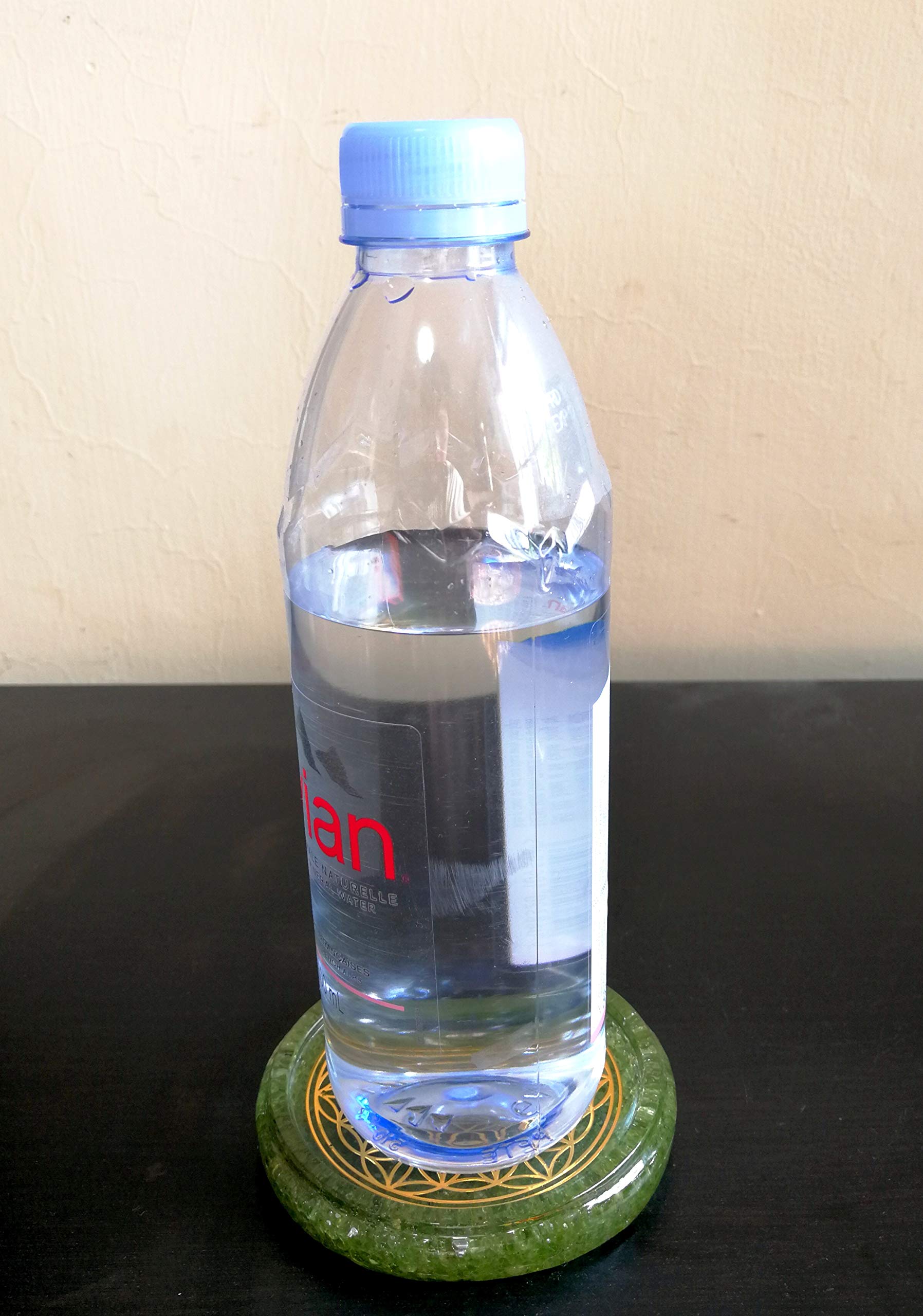 Coaster with crystal elements and metal motif