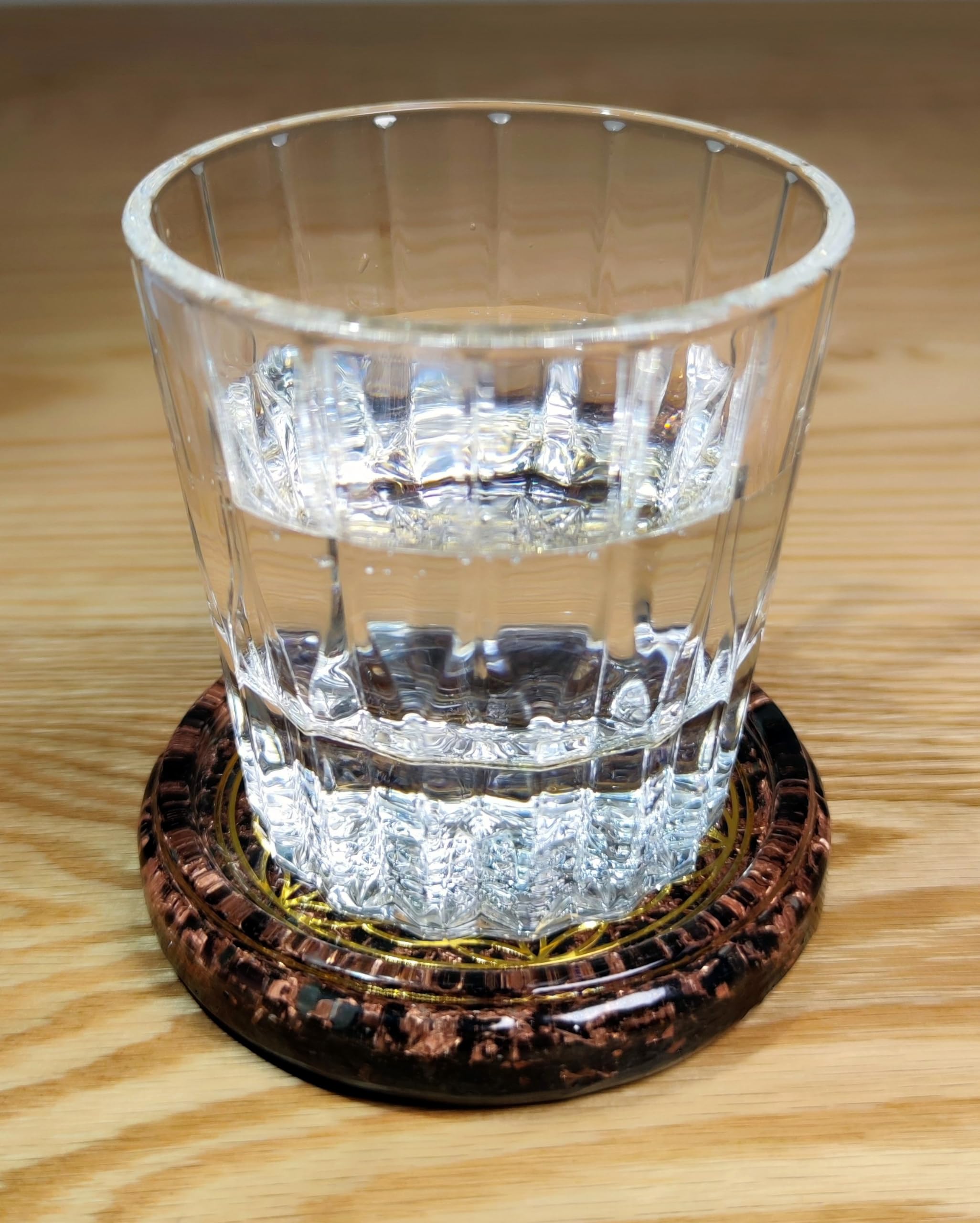 Obsidian crystals Flower of Life symbol and Triskelion on resin coaster