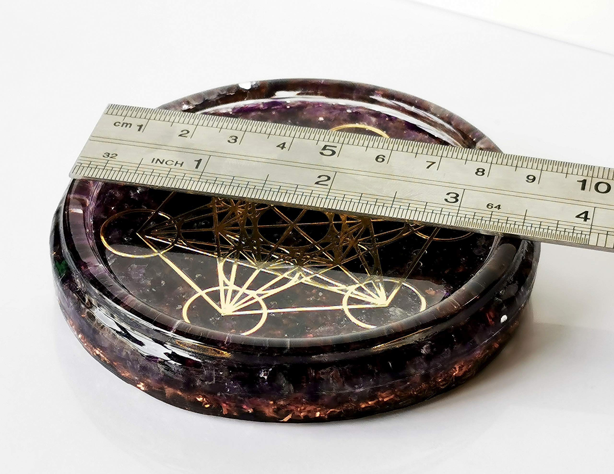 Amethyst crystals and symbol design on coaster